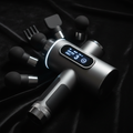SpineCraft PulseMax Pro premium aluminum percussion massage gun with OLED screen and 6 heads hero shot